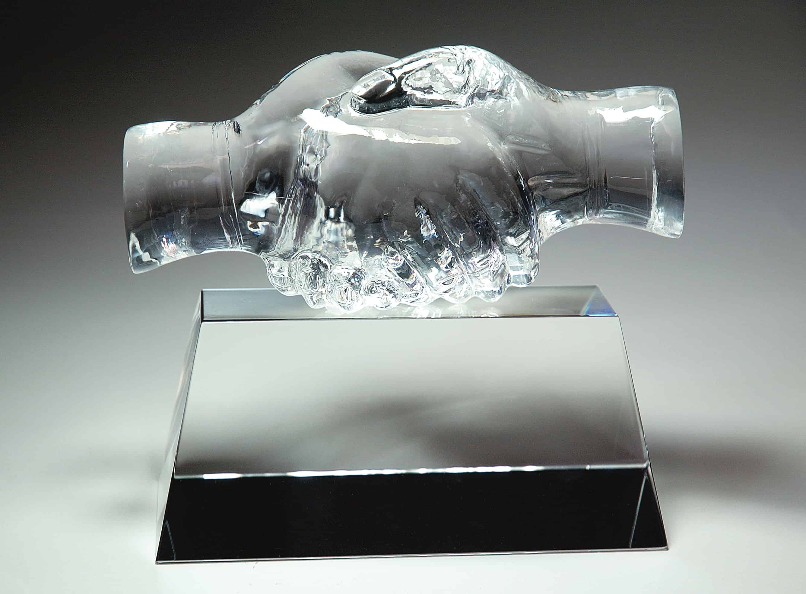 friendship award made of crystal glass customizable with texts and logos on base, handshake crystal