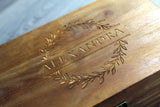 detailed view of engraved essential oil storage case made from wood